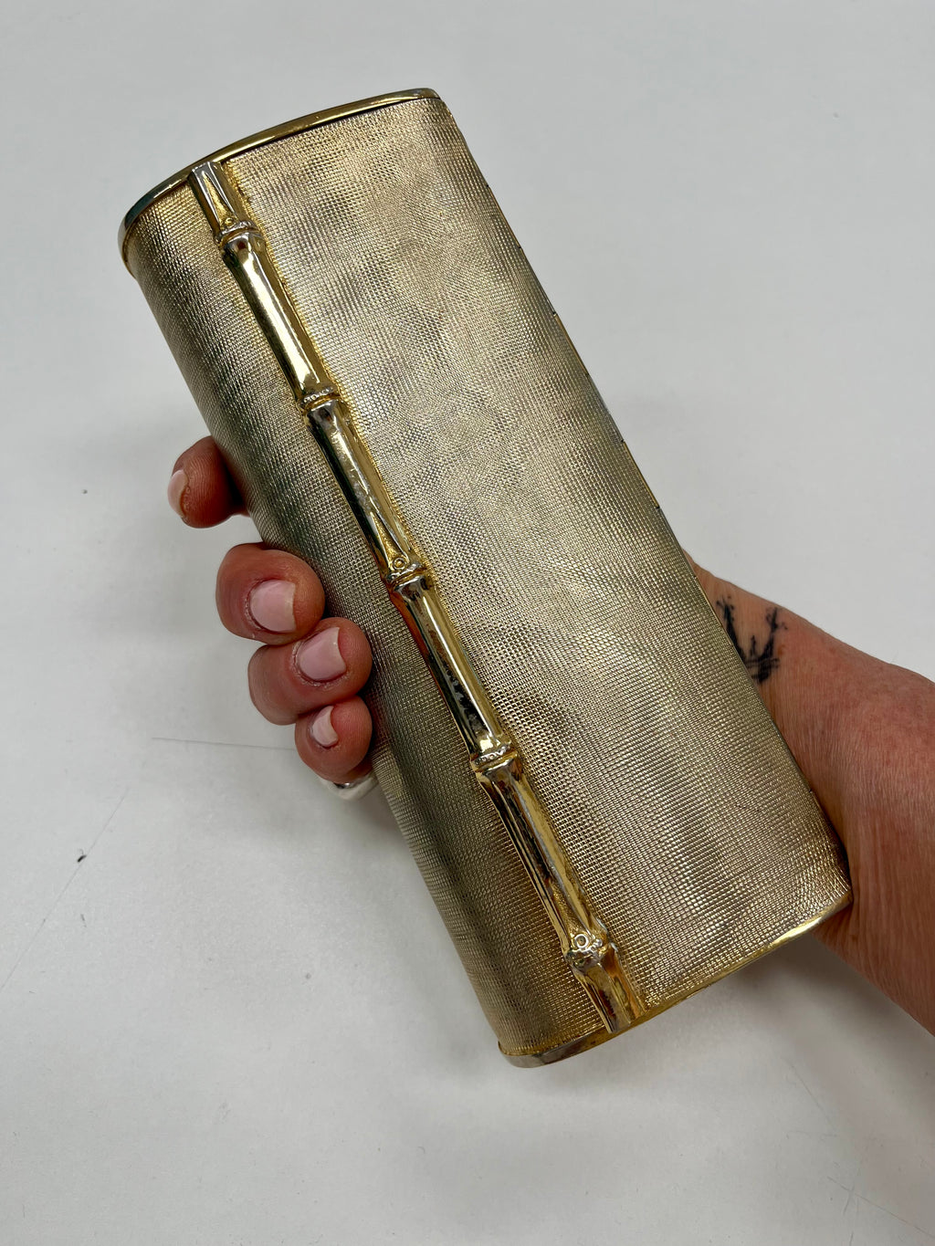 Pochette metallo dorato