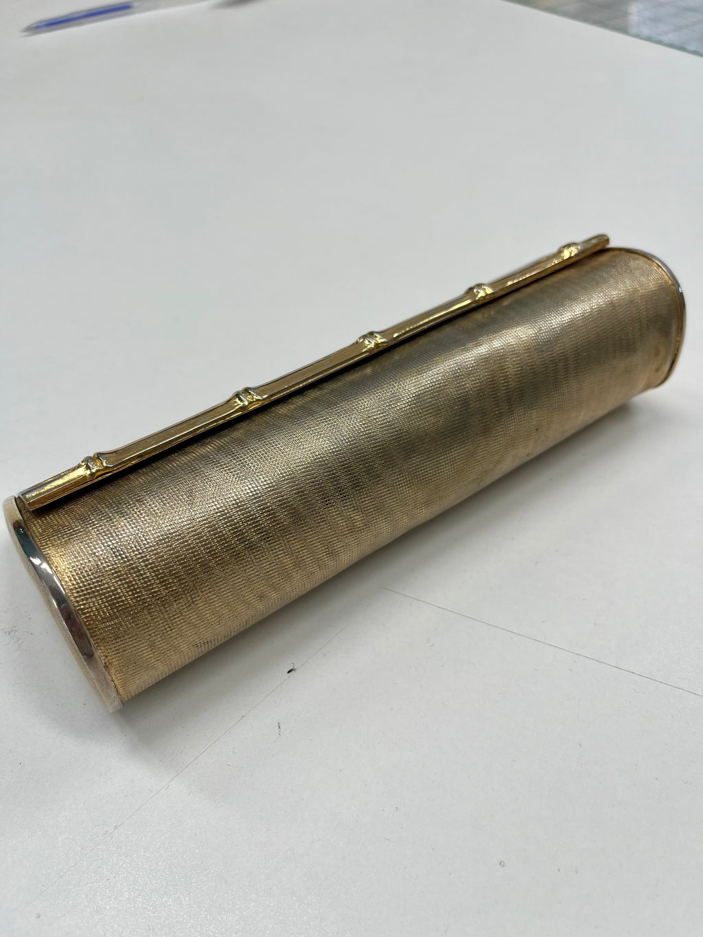 Pochette metallo dorato
